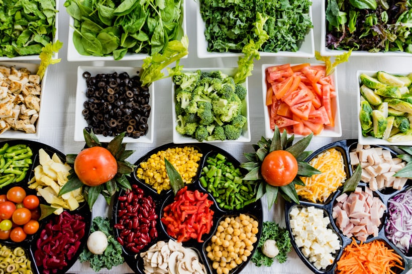 Fresh vegetables and whole foods on a kitchen table